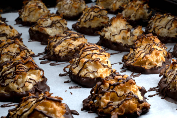 istock Chocolate drizzled coconut macaroons , selective focus. Homemade cookies with coconut 1361150267
