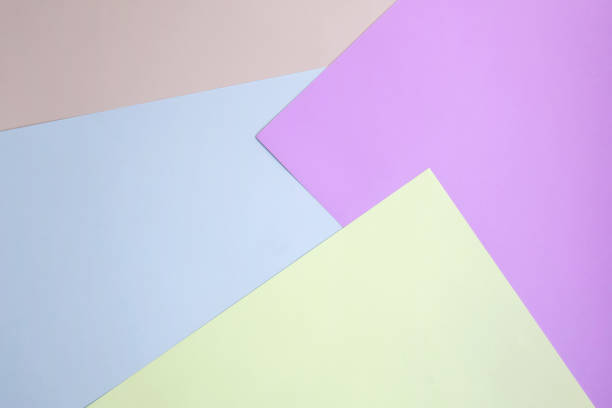 istock Geometric abstract pattern made of sheets of colored paper. Top view. Close-up. Selective focus. Copy space. 1361158862