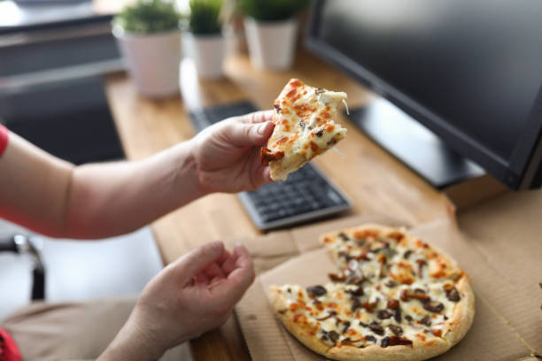 Male arms taking big piece of crusty fresh pizza