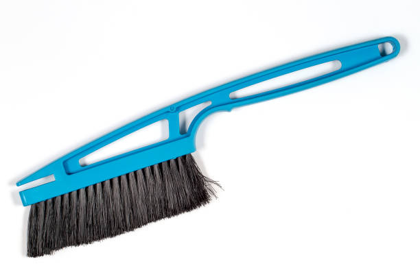 istock Snow cleaning brush on a white background. 1361210547