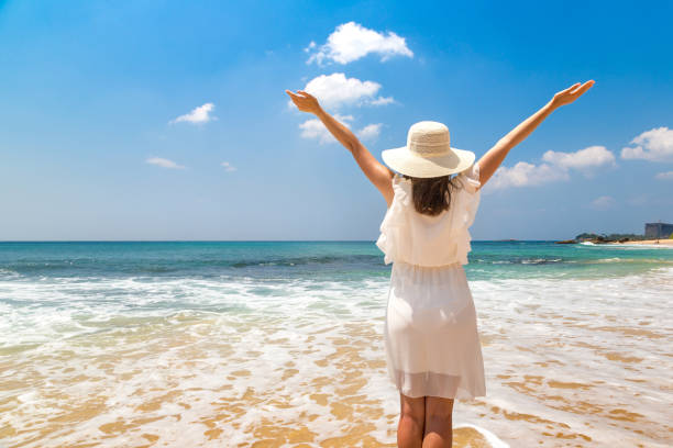 istock Woman on a tropical beach 1361214501