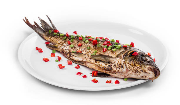 grilled carp on a platter. - fine dining grilled spring onion healthy lifestyle imagens e fotografias de stock