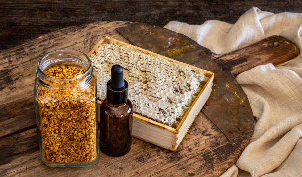 Organic honey with honeycomb and pollen. Antioxidant foods concept with table top view. arrowwood stock pictures, royalty-free photos & images