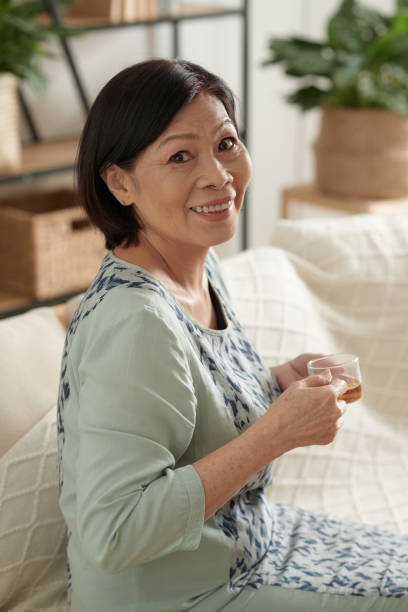 istock Woman Enjoying Cup of Tea 1361217646