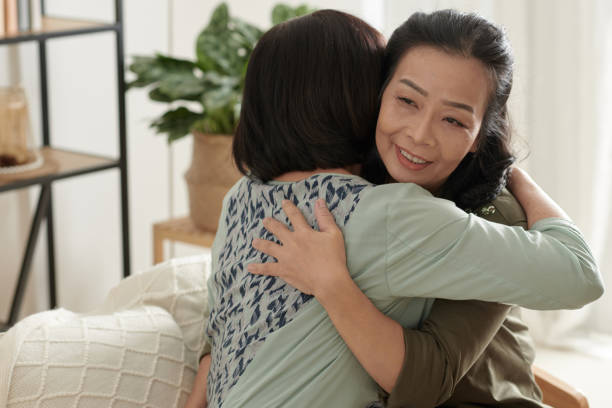 istock Senior Woman Hugging Best Friend 1361217656