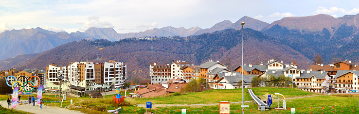 Rosa Khutor, Sochi, Russia, 11.01.2021. Olympic village in the mountains. Panorama of a mountain village on the background of the Caucasus mountains