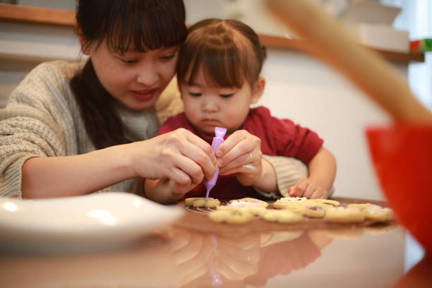 istock Parents and children making sweets 1361239268