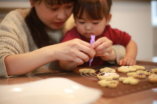istock Parents and children making sweets 1361239477