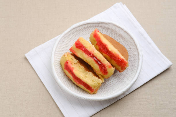 Pukis or Kue Pukis with strawberry jam is a popular traditional snack in Indonesia.