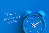 istock Time is Running Out Concept with alarm clock aside. 3d rendering. 1361245717