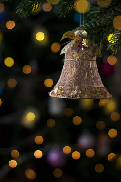 istock Jingle bell toy on Christmas tree. Holiday background. 1361249409