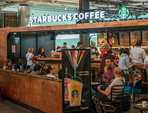Starbucks coffee in Sabiha Gokcen Airport, Istanbul. Starbucks Corporation is the world's largest coffee house chain. It is head-quartered in Seattle, Washington, USA, where the first store opened in 1971.