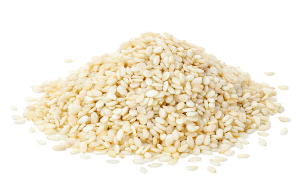 istock heap of sesame seeds isolated on white 1361253567