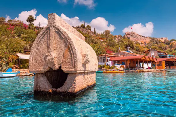 Ancient sunken tomb of the Lycian Greek civilization on the shores of the Mediterranean Sea near the island of Kekova in Turkey. Travel attractions and wonders