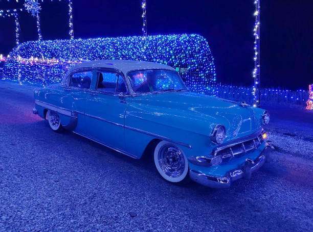 Car driving through display of Christmas lights stock photo