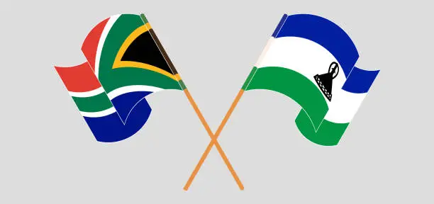 Vector illustration of Crossed and waving flags of South Africa and Kingdom of Lesotho