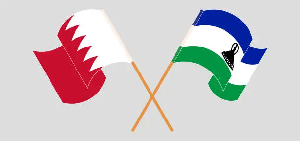 Vector illustration of Crossed and waving flags of Bahrain and Kingdom of Lesotho