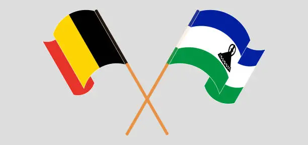 Vector illustration of Crossed and waving flags of Belgium and Kingdom of Lesotho