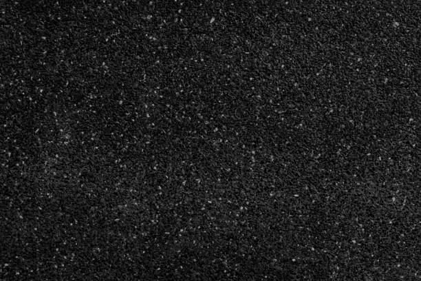 istock Black asphalt on the road or possibly a walking area 1361268053