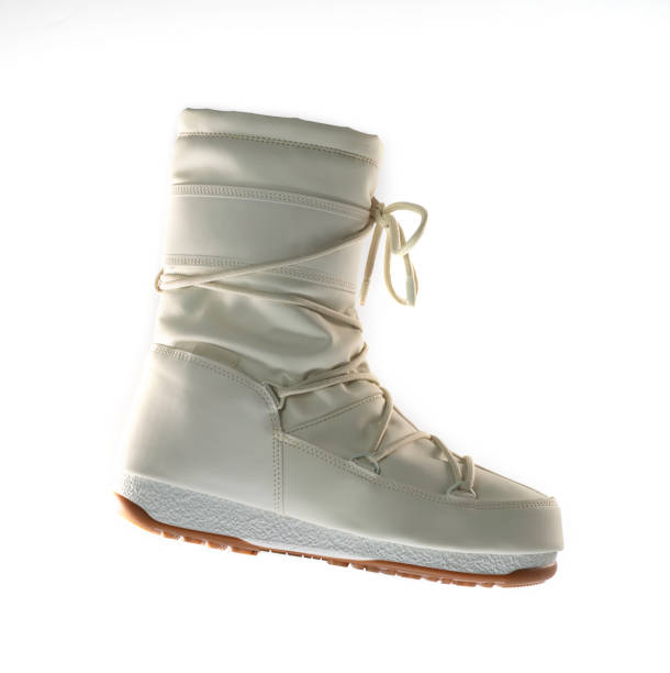 white snow boots, women's fashion, warm boots, moon boot, snow shoes, product photography - moonboots imagens e fotografias de stock