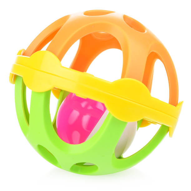 istock Round multicolored rattle on a white background. Plastic toy for children. Developing rattle 1361270459