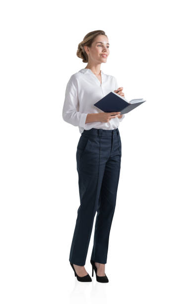 istock Smiling young businesswoman with notebook, isolated 1361271343