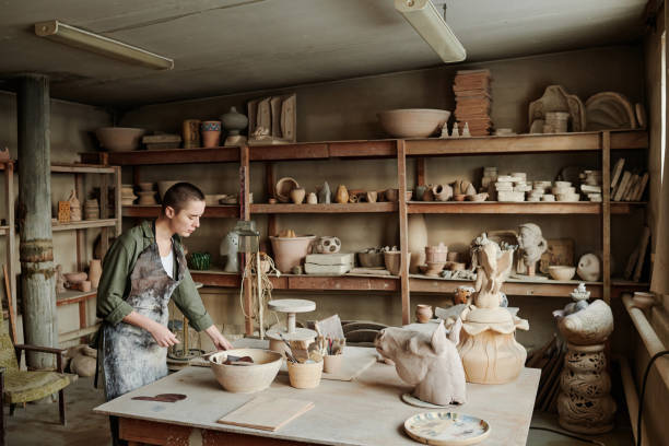 istock Woman creating ceramic sculptures in workshop 1361272958