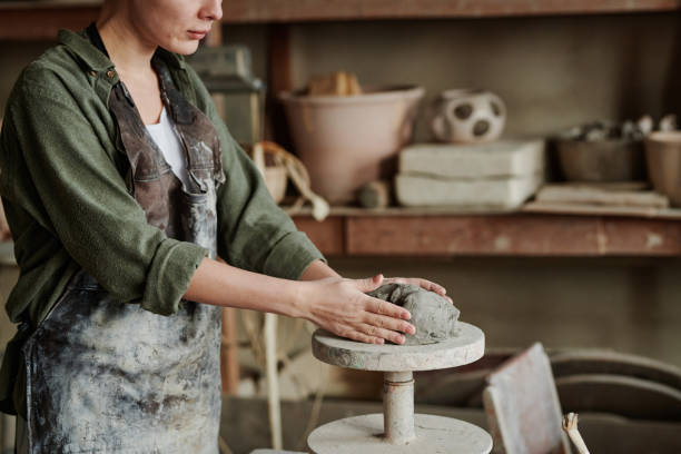 istock Woman working with clay in workshop 1361272965