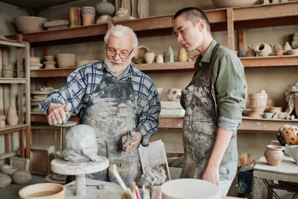 istock The lesson of pottery craft in workshop 1361273184