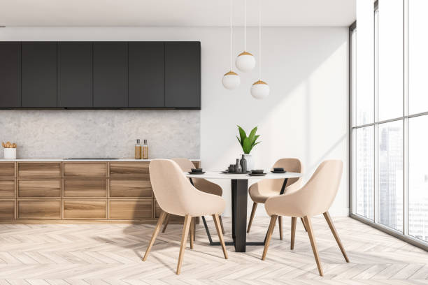 istock White wooden kitchen interior with eating table and kitchen set near window 1361275269