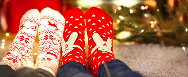 istock Children's feet in Christmas socks 1361276764