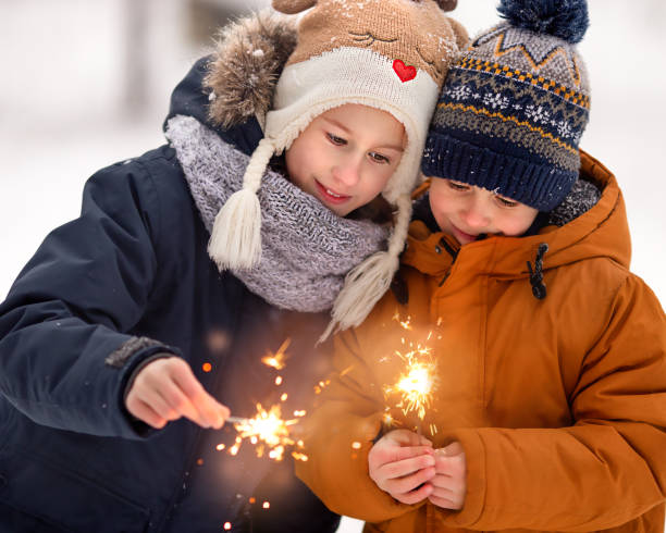 istock Children admire sparklers 1361276769