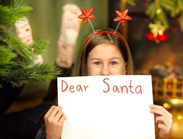 istock Girl writes a letter to Santa 1361277829