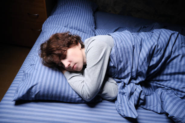 istock Mature woman is sleeping in her bed 1361278092