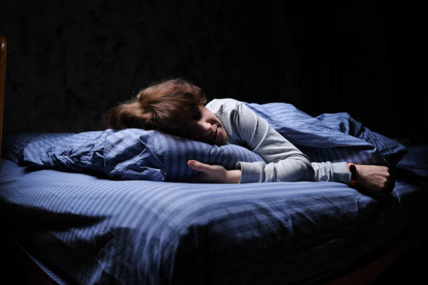 istock Mature woman is sleeping in her bed 1361278153
