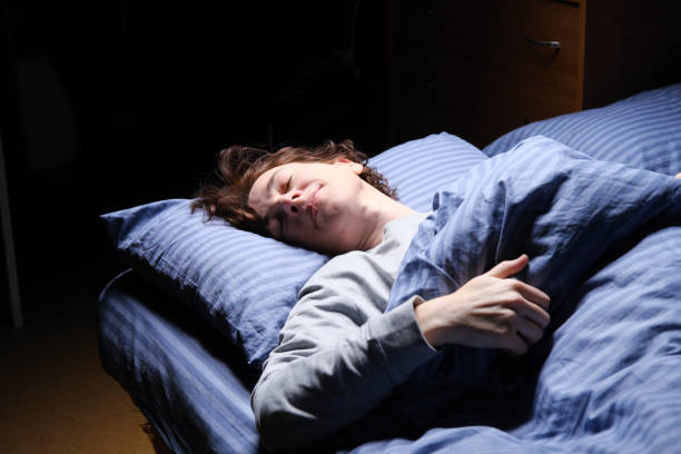 istock Mature woman is sleeping in her bed 1361278165