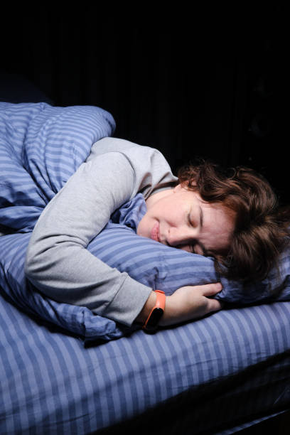 istock Mature woman is sleeping in her bed 1361278642
