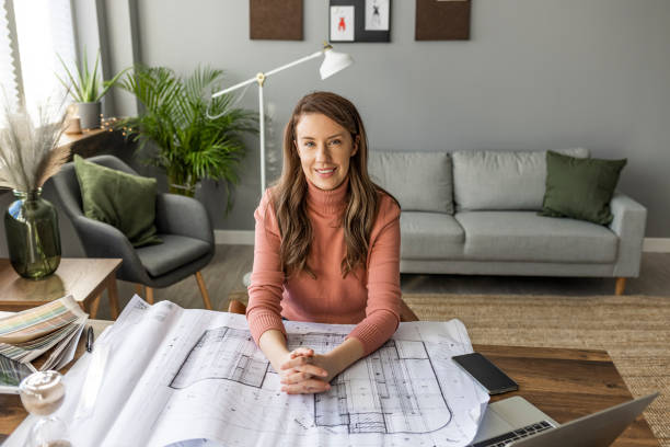 istock Female architect working at home. 1361288060