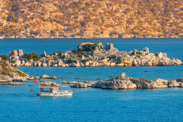 Kekova Island with its famous sunken city is one of the most popular destinations in Turkey attracts many travelers on boat tours and sea cruise ships. Idyllic aerial view at sunset Kekova Island with its famous sunken city is one of the most popular destinations in Turkey attracts many travelers on boat tours and sea cruise ships. Idyllic aerial view at sunset kekova stock pictures, royalty-free photos & images