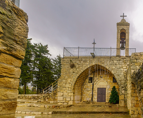 View of the old Maronite church in Baram National Park, with a Christmas tree, on a winter day. Upper Galilee, Northern Israel