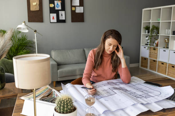 istock Woman headache stressed because of work mistake problems 1361289300