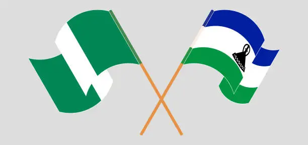 Vector illustration of Crossed and waving flags of Nigeria and Kingdom of Lesotho