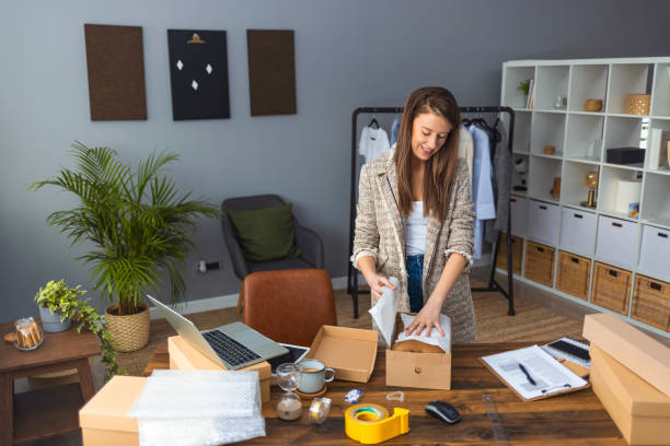 istock Female online seller confirming orders from customer 1361293015