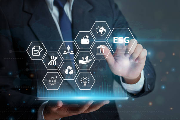 istock Businessman touching button ESG on-screen with connected virtual icons over the background.ESG environmental social governance business strategy investing concept. 1361297268