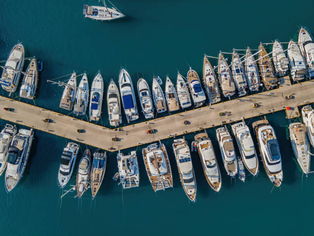 Aerial top-down view of docked sailboats stock photo