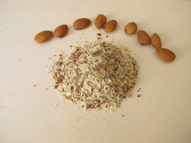 istock Almond flour, ground almonds on a wooden board 1361298492