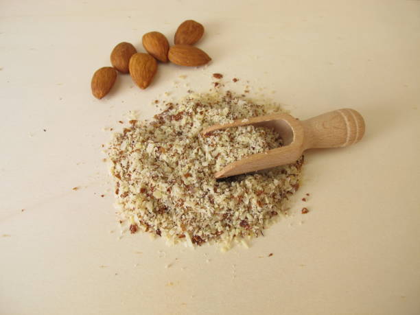 istock Almond flour, ground almonds on a wooden board 1361298499