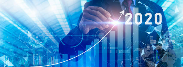 istock New year 2022 and start growth plan in 2022.businessman pointing graph future growth plan in 2022.Business strategy and development.Artificial intelligence(AI) support to increase business 1361298711