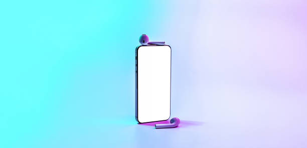 istock Smartphone screen. Mobile smart phone technology blank screen. Mock up smart phone device, audio headphones equipment on neon gradient background. For text message, information content, clipping path. 1361299201