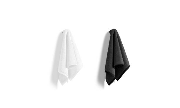 istock Blank black and white towel hanging on hook mock up 1361301885